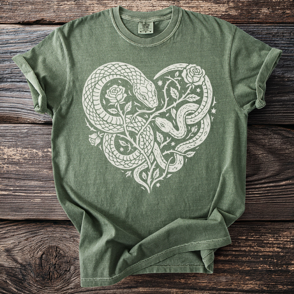 Olive green t-shirt with white snakes and roses forming a heart shape.