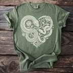 Olive green t-shirt with white snakes and roses forming a heart shape.