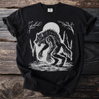 Werewolf illustration on black t-shirt with moon and trees.