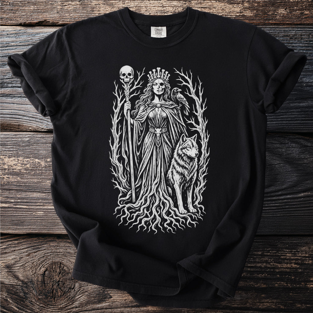 Black t-shirt with white graphic of a crowned woman with skull details, wolf, crow, and staff with skull.