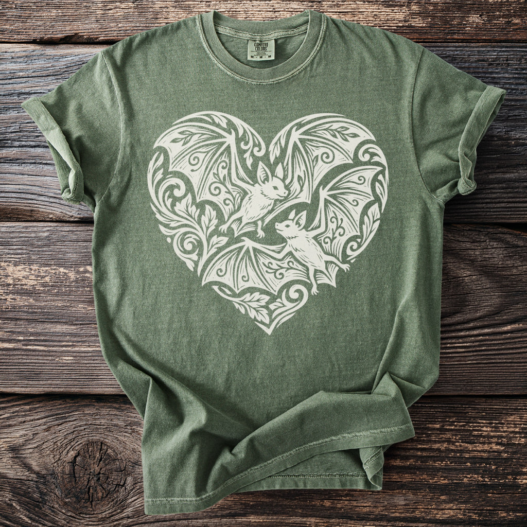 Green t-shirt with a white bat-filled heart graphic and Comfort Colors tag.