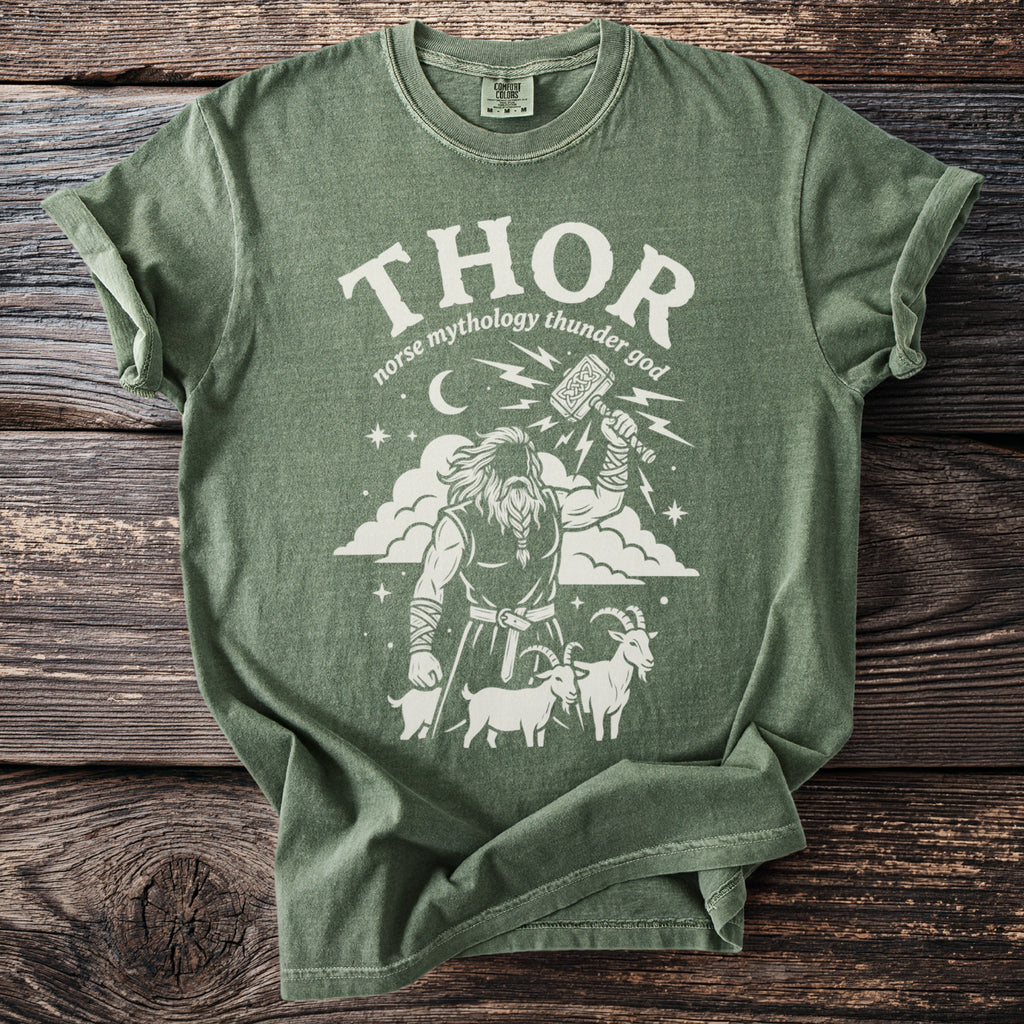 Green t-shirt with Thor, Mjolnir, goats, and lightning bolt graphic.