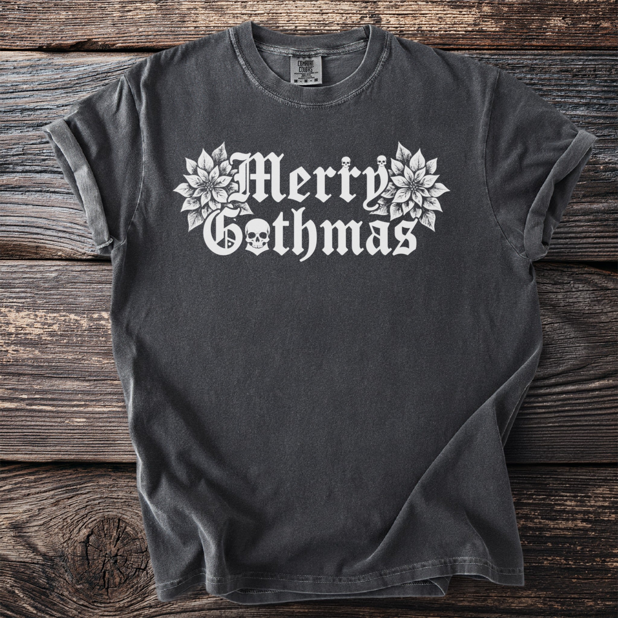Dark grey t-shirt with white "Merry Gothmas" text and skull graphic.