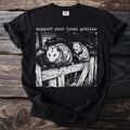 Black t-shirt with "support your local goblins" and opossums on a wooden fence.