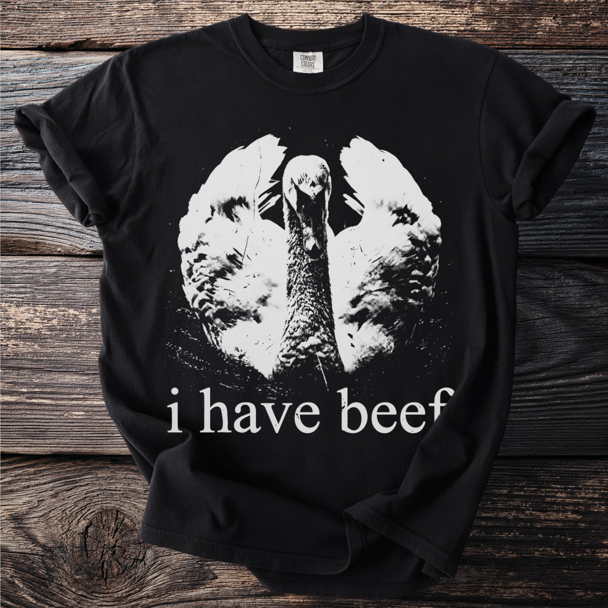 Black t-shirt with white graphic of a turkey and text "i have beef".