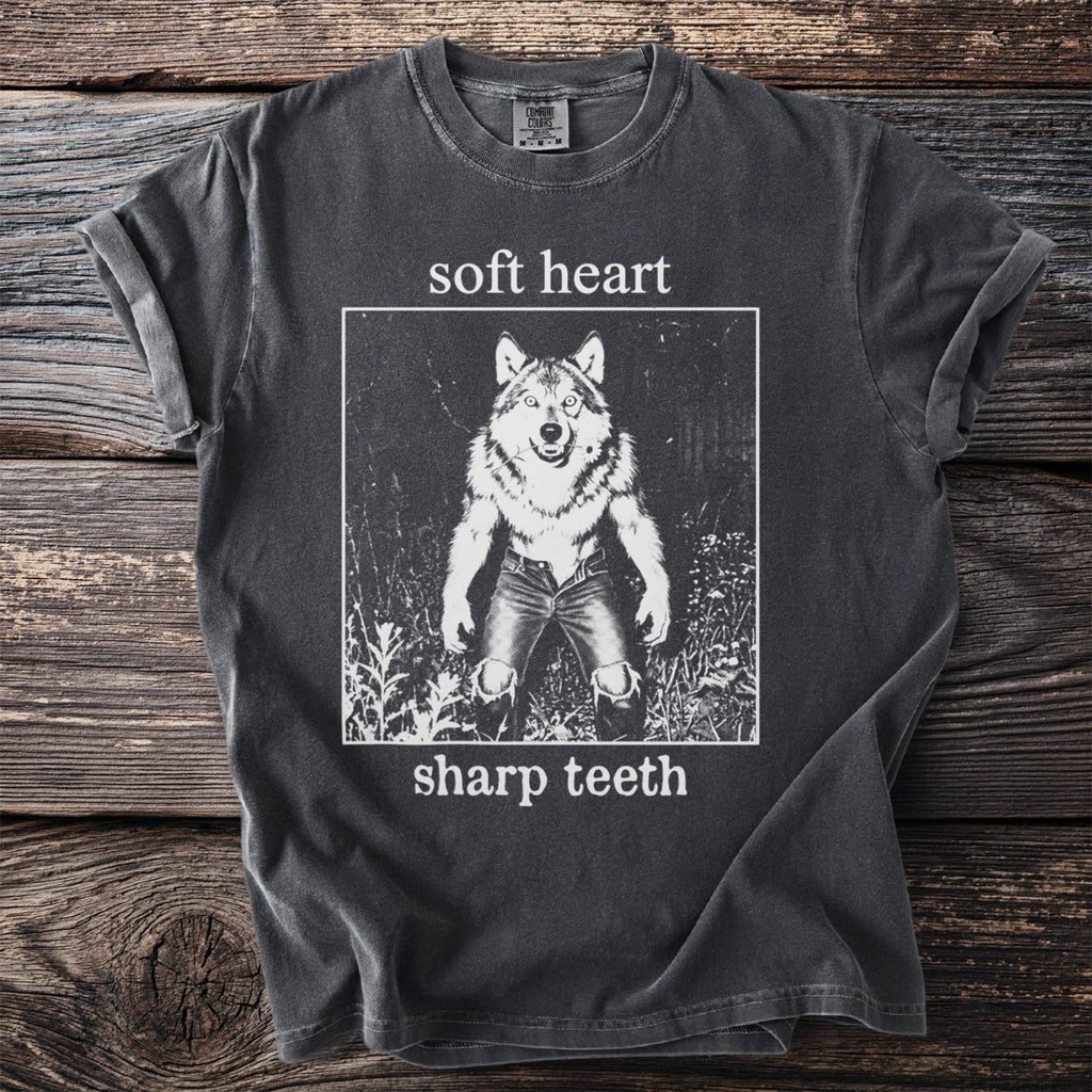 Dark grey t-shirt with wolf graphic and text "soft heart sharp teeth".