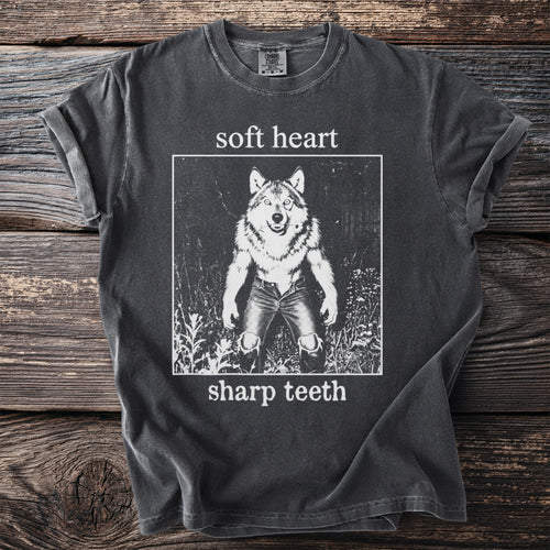 Dark grey t-shirt with wolf graphic and text "soft heart sharp teeth".
