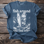 Blue t-shirt graphic with opossum holding large trout, text "fish around and find trout".