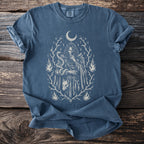 T-shirt with white sketch of mystic figure, snake, fox head, moon, and flames.