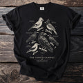 Black t-shirt with line drawings of six corvid birds: Eurasian, Steller's Jays, Red-billed and Alpine Choughs, Clark's Nutcracker, and Common Raven.
