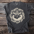 Pepper t-shirt with a luna moth and stoat flanking a rune inside a berry wreath.