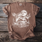 Brown t-shirt with graphic of two bass jumping from water under a full moon.