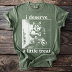 Green t-shirt with wolf at open refrigerator holding cake, text "i deserve a little treat".