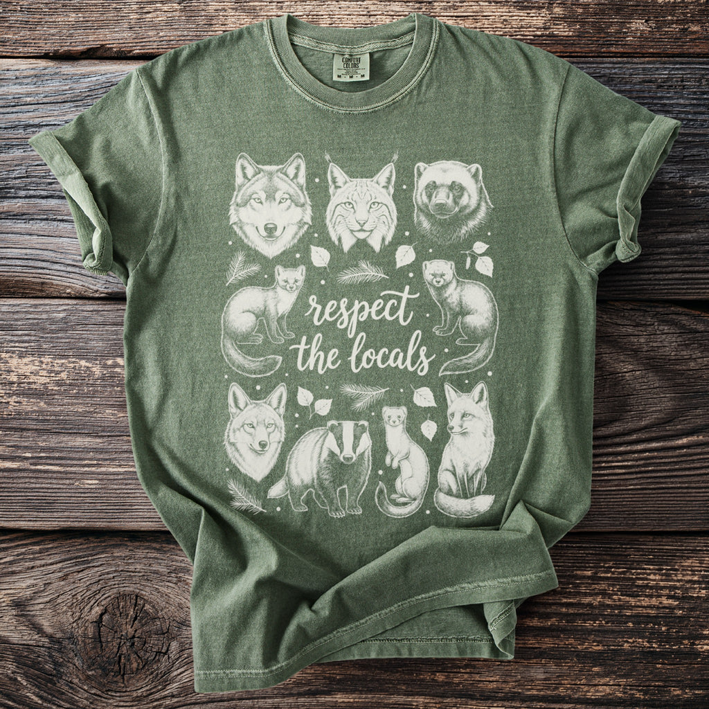 Green t-shirt with white line art of various woodland animals and "respect the locals" text.