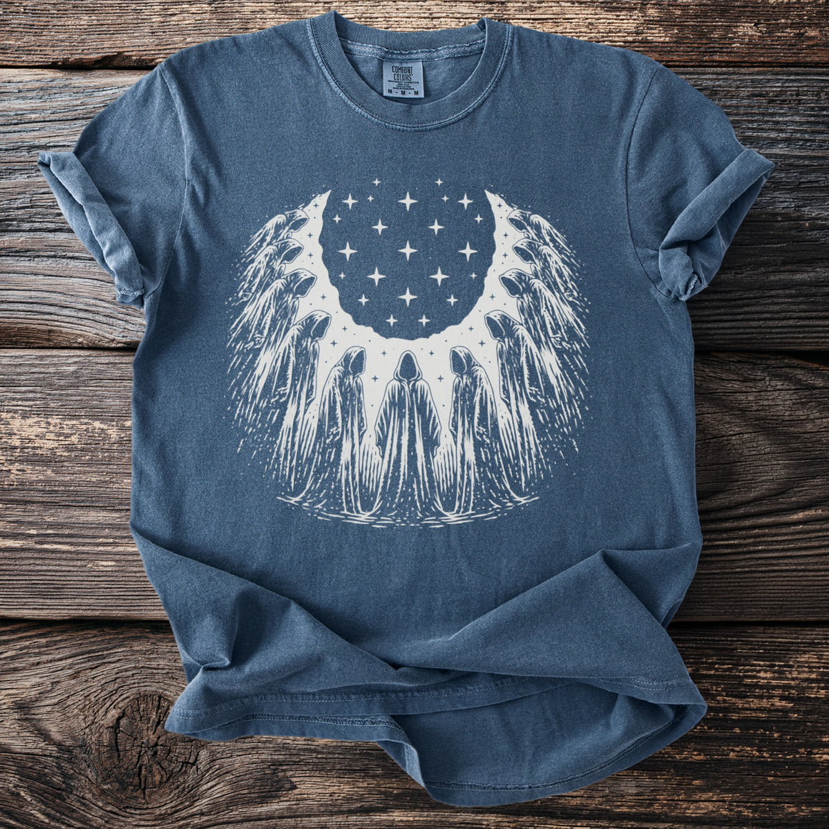 Blue t-shirt with white graphic of robed figures and stars forming a crescent.
