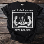Black t-shirt with "god forbid women have hobbies" and Ouija board art.