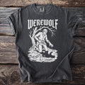 Dark t-shirt with white "WEREWOLF" text and illustration of a man transforming under a tree.