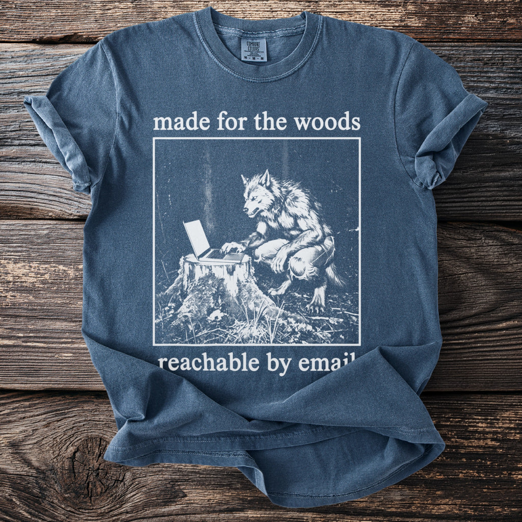 Blue t-shirt with werewolf at laptop, "made for the woods reachable by email" text.