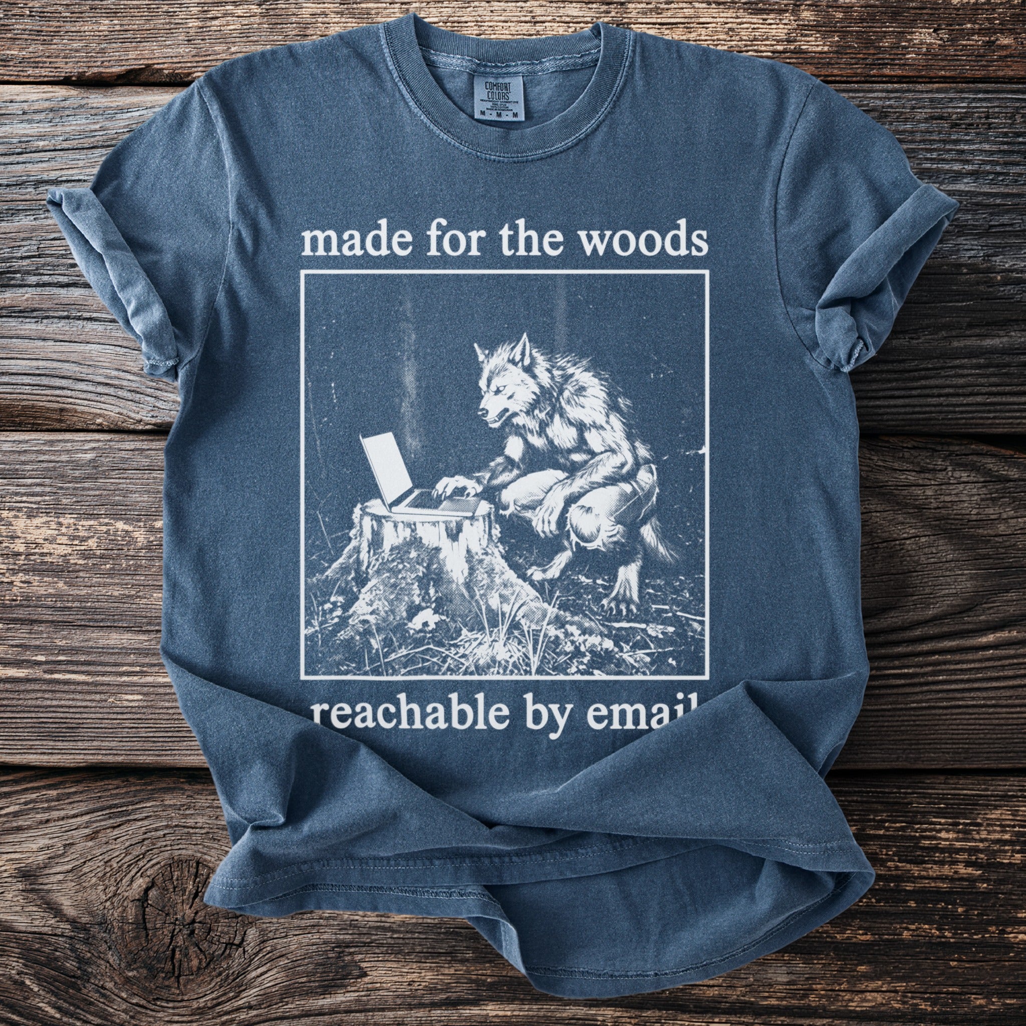 Blue t-shirt with werewolf at laptop, "made for the woods reachable by email" text.