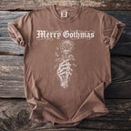 Brown t-shirt with white "Merry Gothmas" text and a skeleton hand holding a rose.