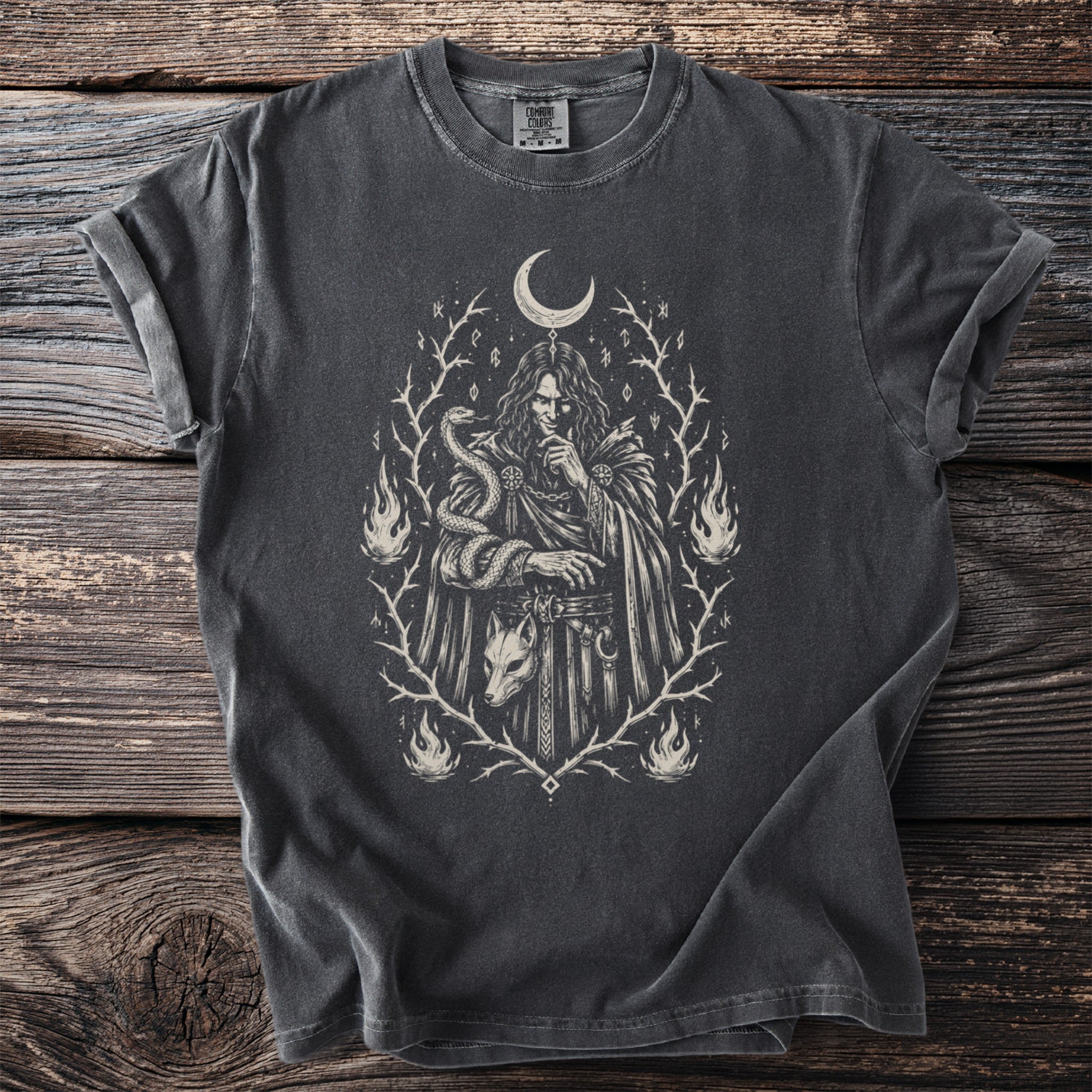 Dark grey t-shirt with a mystical illustration of a figure, snake, fox mask, and flames.
