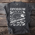 Dark gray t-shirt with "OPOSSUM" text and white opossum illustration.