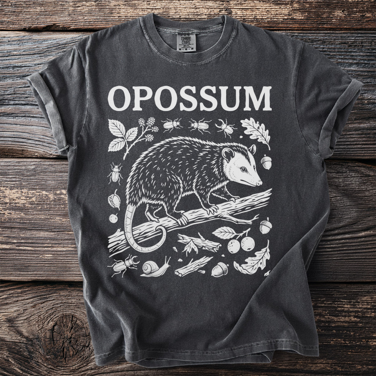 Dark gray t-shirt with "OPOSSUM" text and white opossum illustration.