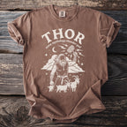 Brown t-shirt with white graphic of Thor raising Mjolnir, flanked by goats and clouds.