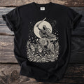 Black t-shirt with a moon chariot pulled by cats and a winged figure.