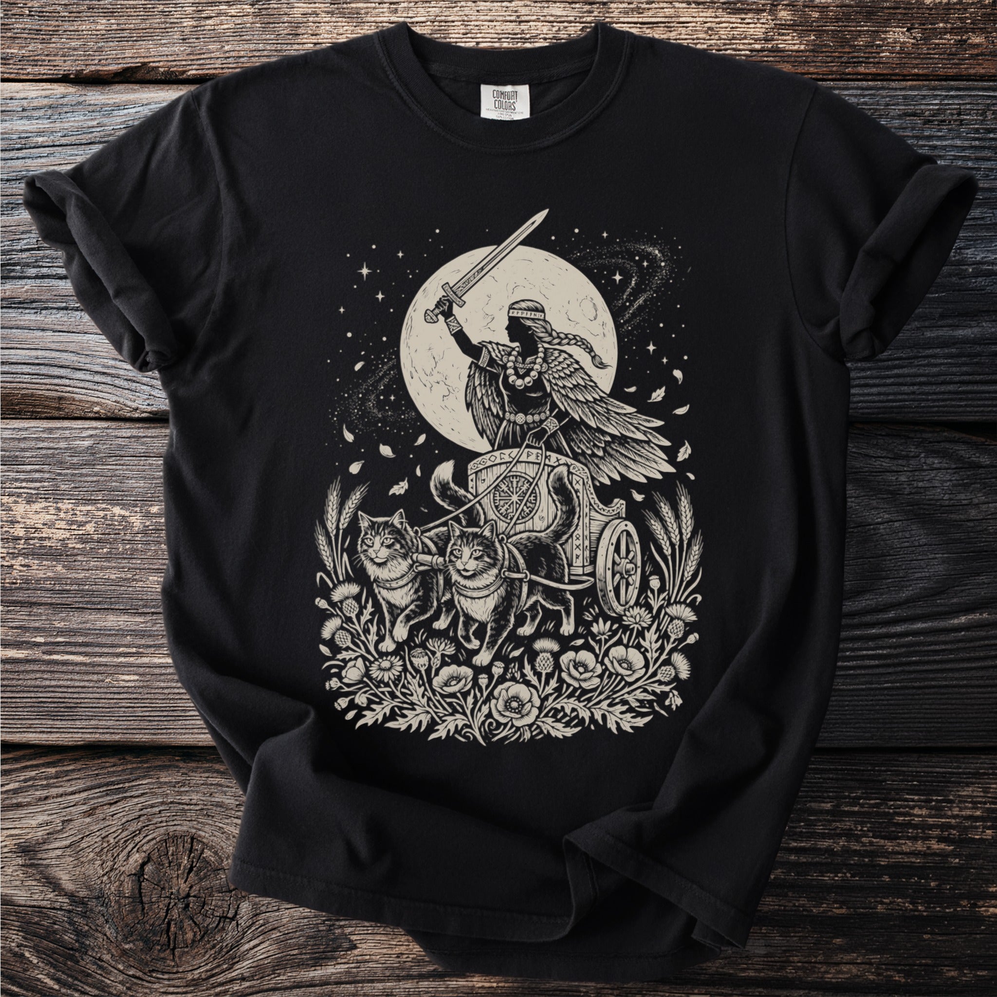 Black t-shirt with a moon chariot pulled by cats and a winged figure.