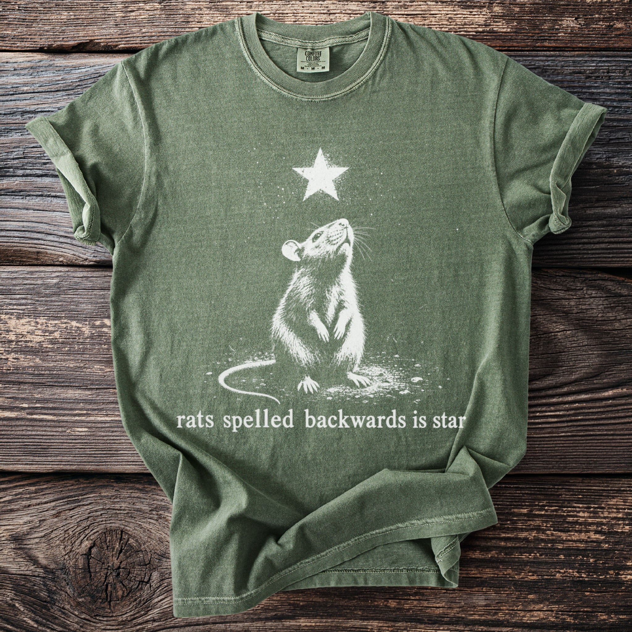 Green t-shirt with white graphic of a rat looking up at a star, text reads "rats spelled backwards is star".