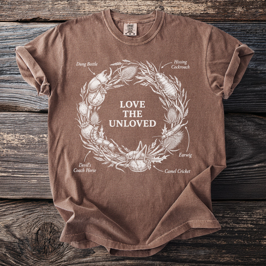 Brown t-shirt with circular design featuring insects and the text "LOVE THE UNLOVED".