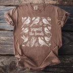 T-shirt with white line art of various birds and "respect the locals" text.