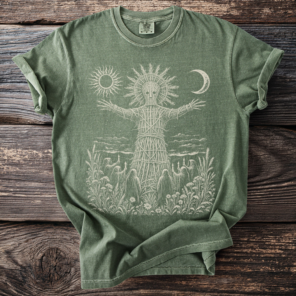 Green t-shirt with wicker man, sun, moon and robed figures graphic.