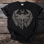 Black t-shirt with cream dragonfly, crescent moon, and floral design.