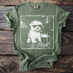 Green t-shirt with white graphic of a dog wearing sunglasses and smoking a cigarette.