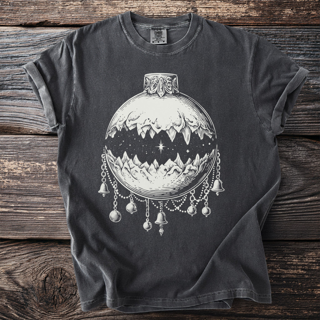 Dark grey t-shirt with white graphic of a moon phase ornament with mountains and bells.