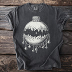 Dark grey t-shirt with white graphic of a moon phase ornament with mountains and bells.