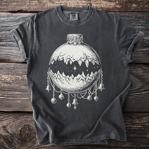 Dark grey t-shirt with white graphic of a moon phase ornament with mountains and bells.