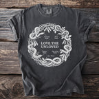 Dark gray t-shirt with "LOVE THE UNLOVED" and snake illustration.