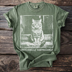Green t-shirt with a graphic of a cat sitting on steps and the words "emotionally unavailable".