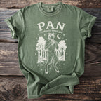 Green t-shirt with a white graphic of the god Pan playing panpipes in a forest.
