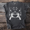 Dark gray t-shirt with a white graphic of a horned devil face and hands forming a heart.