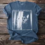 T-shirt with text "please do not perceive me" and a black cat peeking.