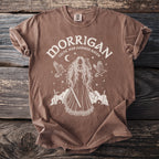 Brown t-shirt with white print of Morrigan, Celtic war goddess, holding a sword and axe.