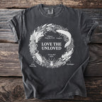 Dark grey t-shirt with "Love the Unloved" and illustration of unloved creatures.