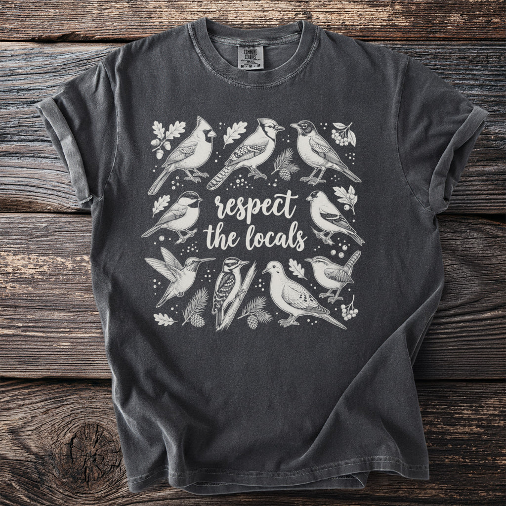 Dark grey t-shirt with white illustration of various birds and text respecting the locals.