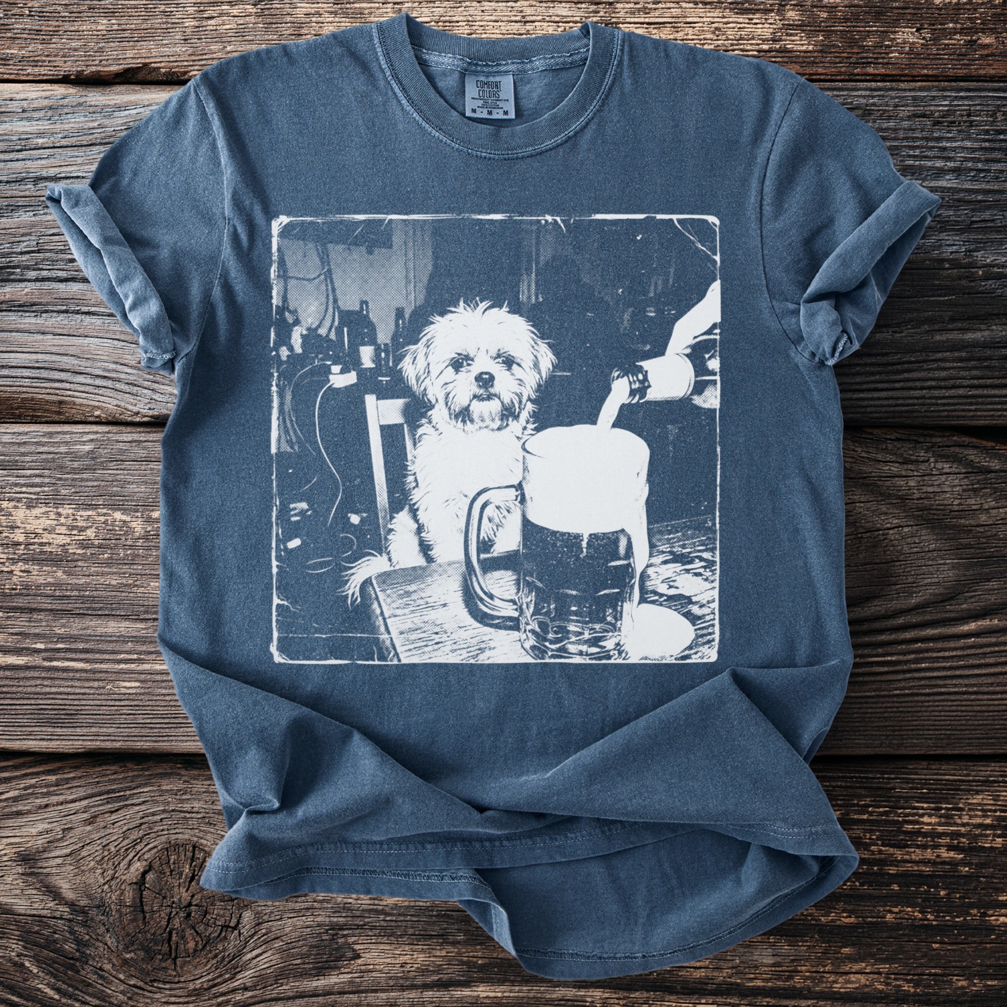 White graphic of a dog sitting at a table, with a beer being poured into a mug.