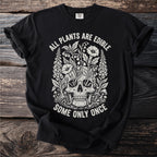 Black t-shirt with white graphic of a skull entwined with plants and text.