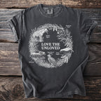 Dark grey t-shirt with "Love the Unloved" text and illustrations of animals.